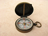 Antique brass cased pocket compass signed 'AITCHISON LONDON'